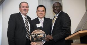 Dr. Randy Edwards, Appalachian’s vice chancellor for university advancement, far left, and Dr. Jesse Lutabingwa, associate vice chancellor for international education and development at Appalachian, far right, present Jigang “Harrison” He with the inaugural Appalachian Global Engagement Award at the Global Leadership Awards Luncheon held during Appalachian’s International Education Week in November. 