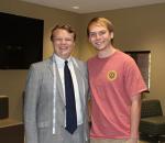 Zach Hunt measured for a business suit by Corner Tailors Founder Merrick Marquie